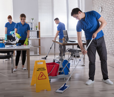 Global Janitorial team cleaning an office